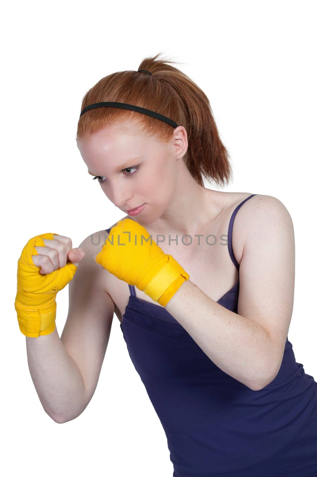 A beautiful young woman wearing a pair of boxing gloves