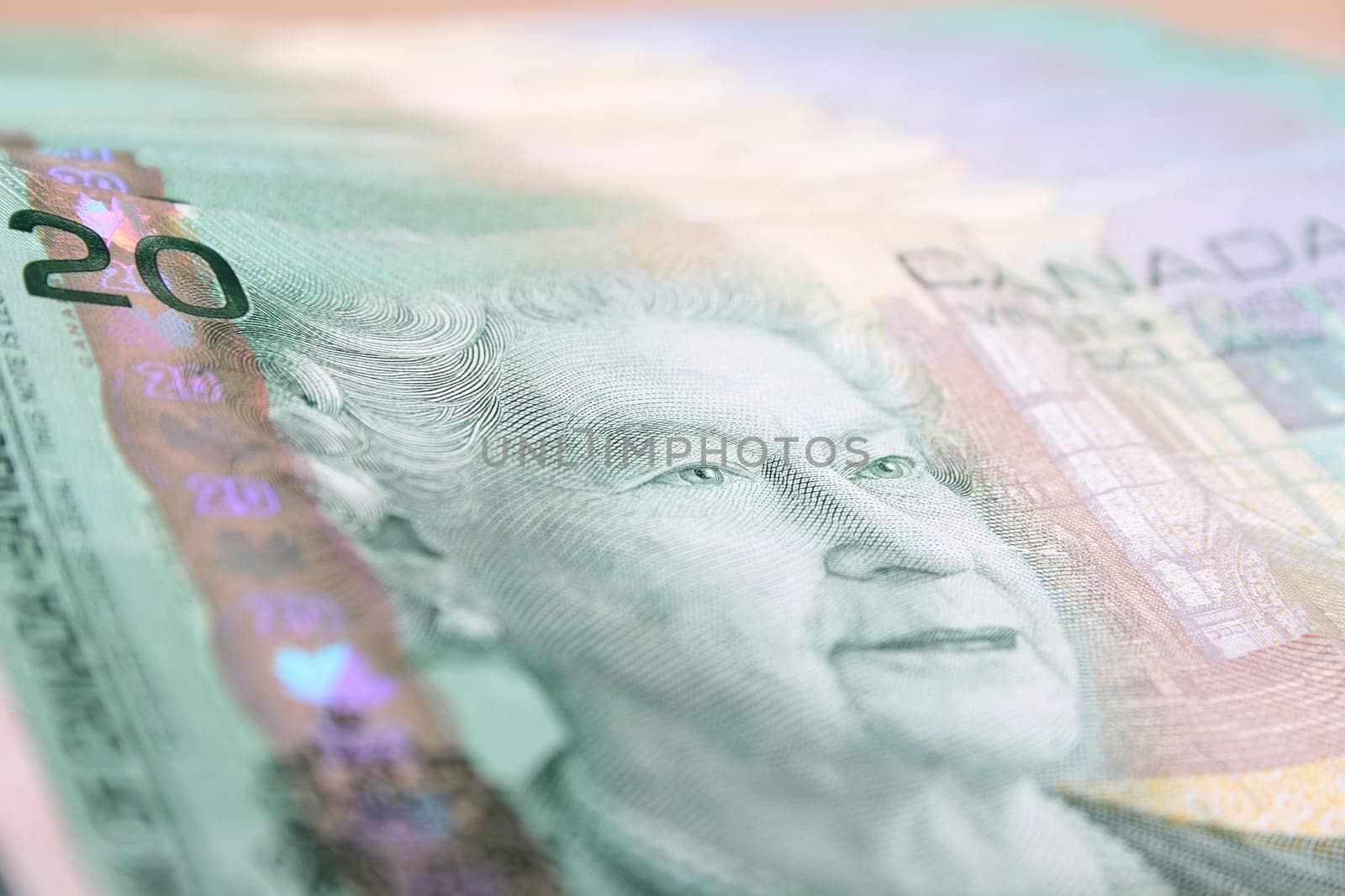 Canadian currency twenty dollar notes on a pile