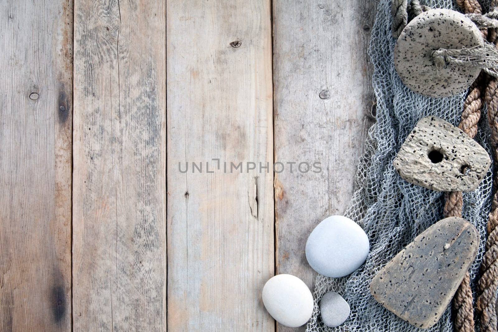 Cork, fishing net and rope with wooden background