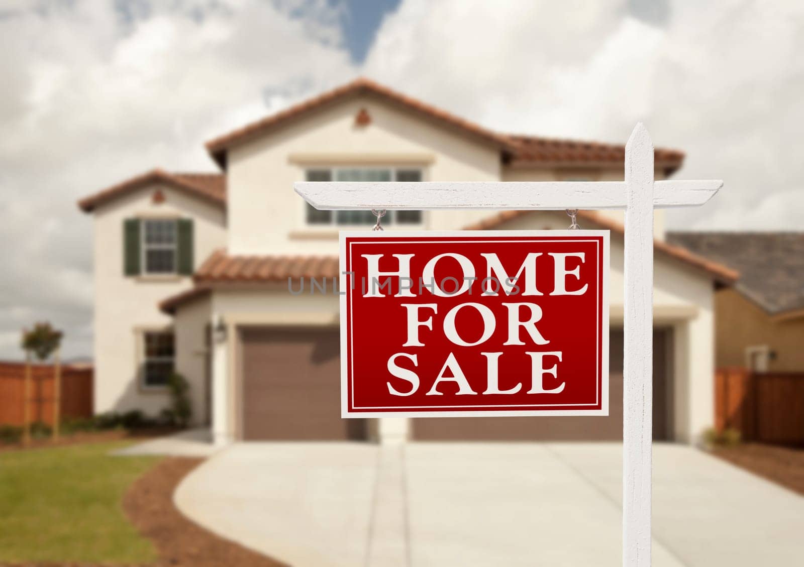 Home For Sale Real Estate Sign in Front of New House.