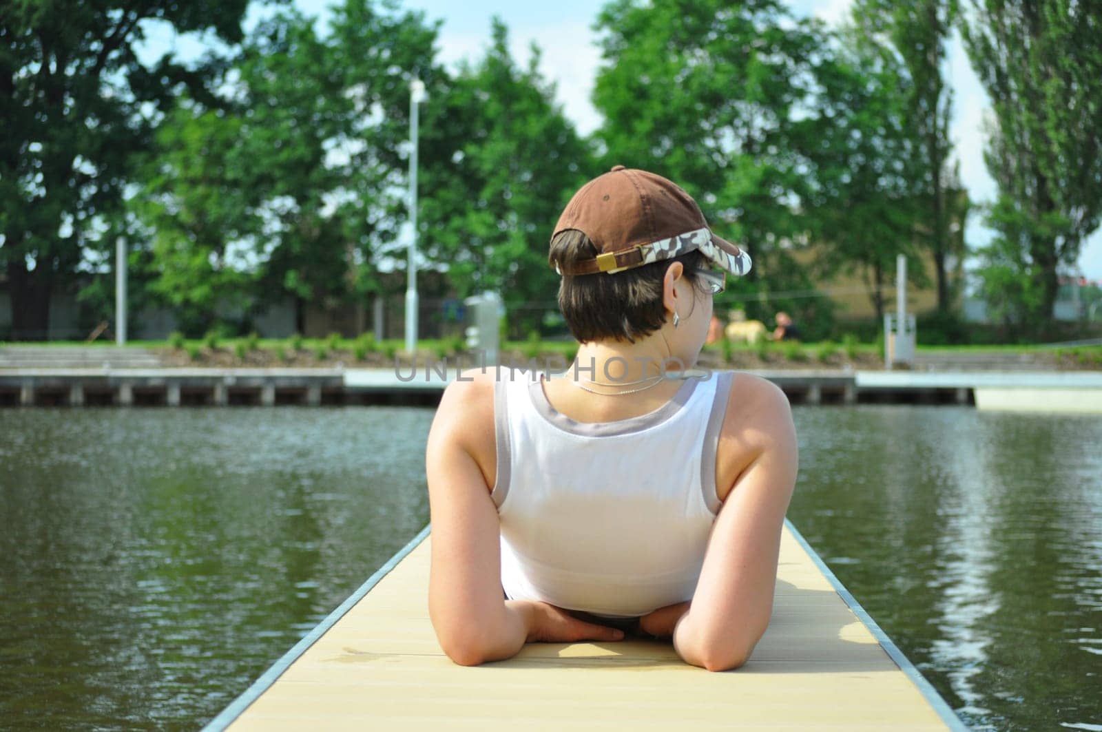 young girl on harbor pier