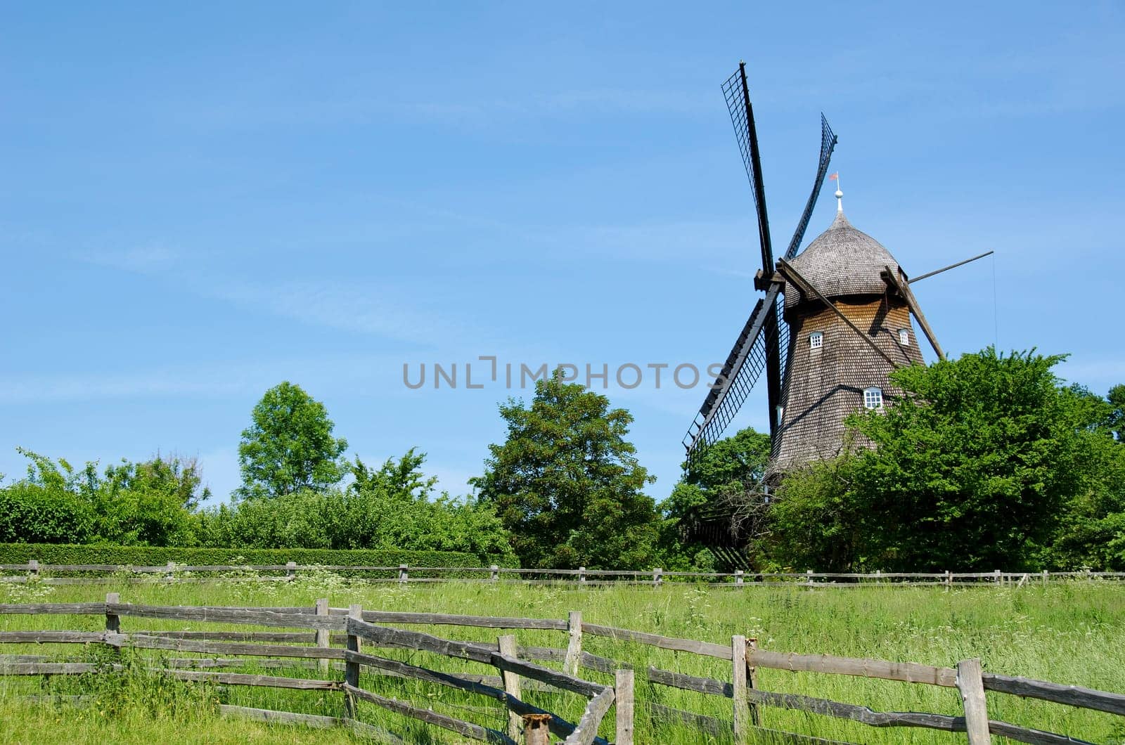 Traditional wooden wind mill in a museum in Denmark