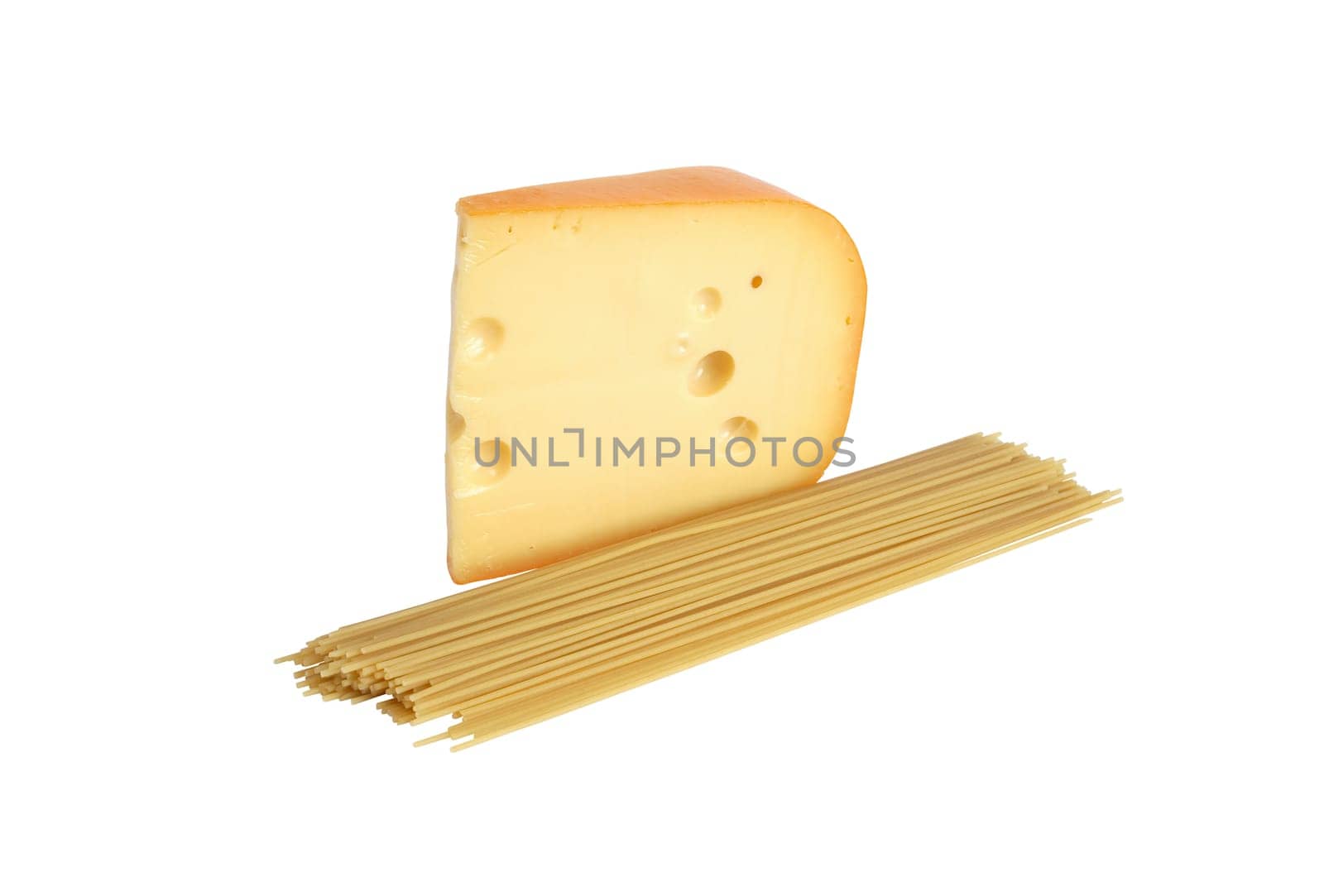 Big piece of cheese near raw spaghetti on white background. Isolated with clipping path