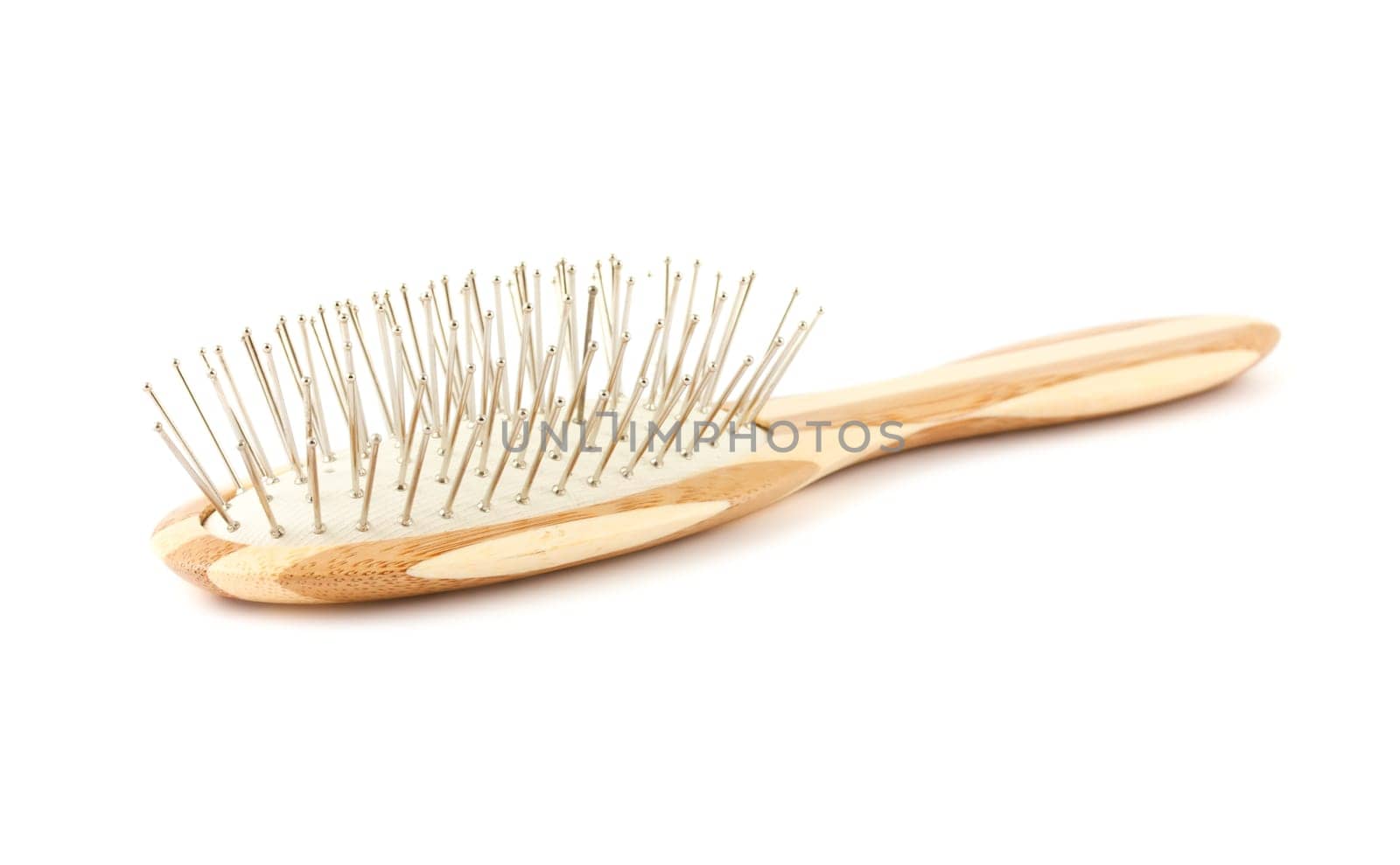 Single bamboo hair brush isolated on a white background. .