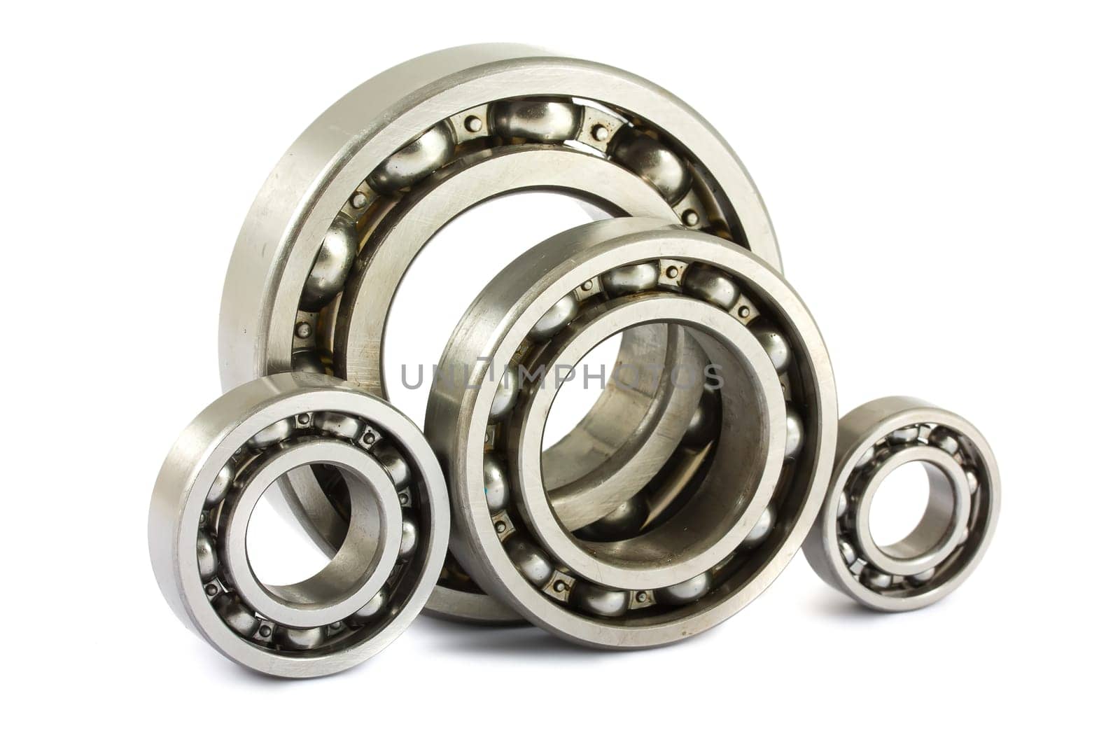 Four steel ball bearings isolated on a white background