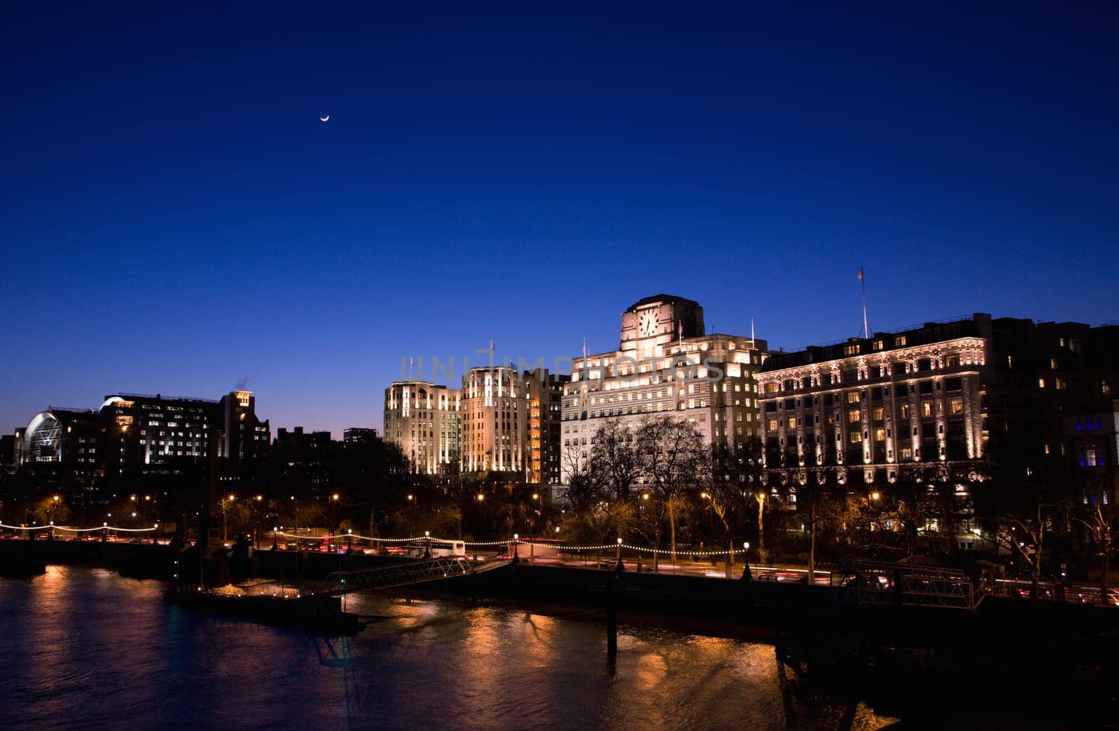 London Victoria Embankment Night View seen from Waterloo Bridge - Embankment Place, Adelphi Terrace and Shell Mex House from Left .