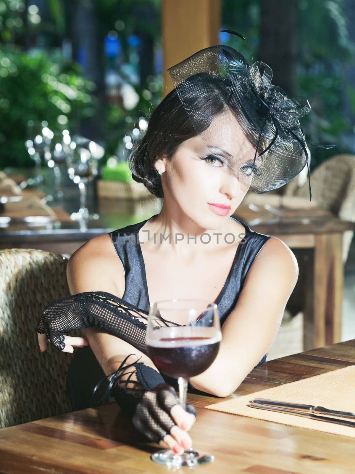 Fashion woman retro portrait in a restaurant