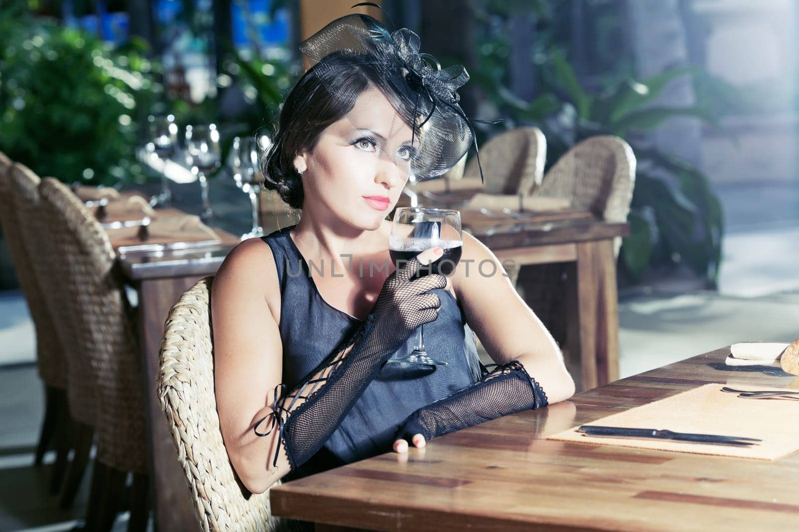 Fashion woman retro portrait in a restaurant