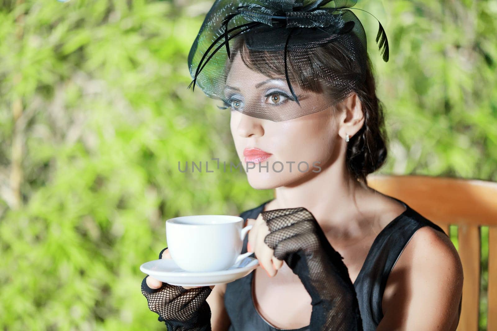 Fashion woman retro portrait in a restaurant
