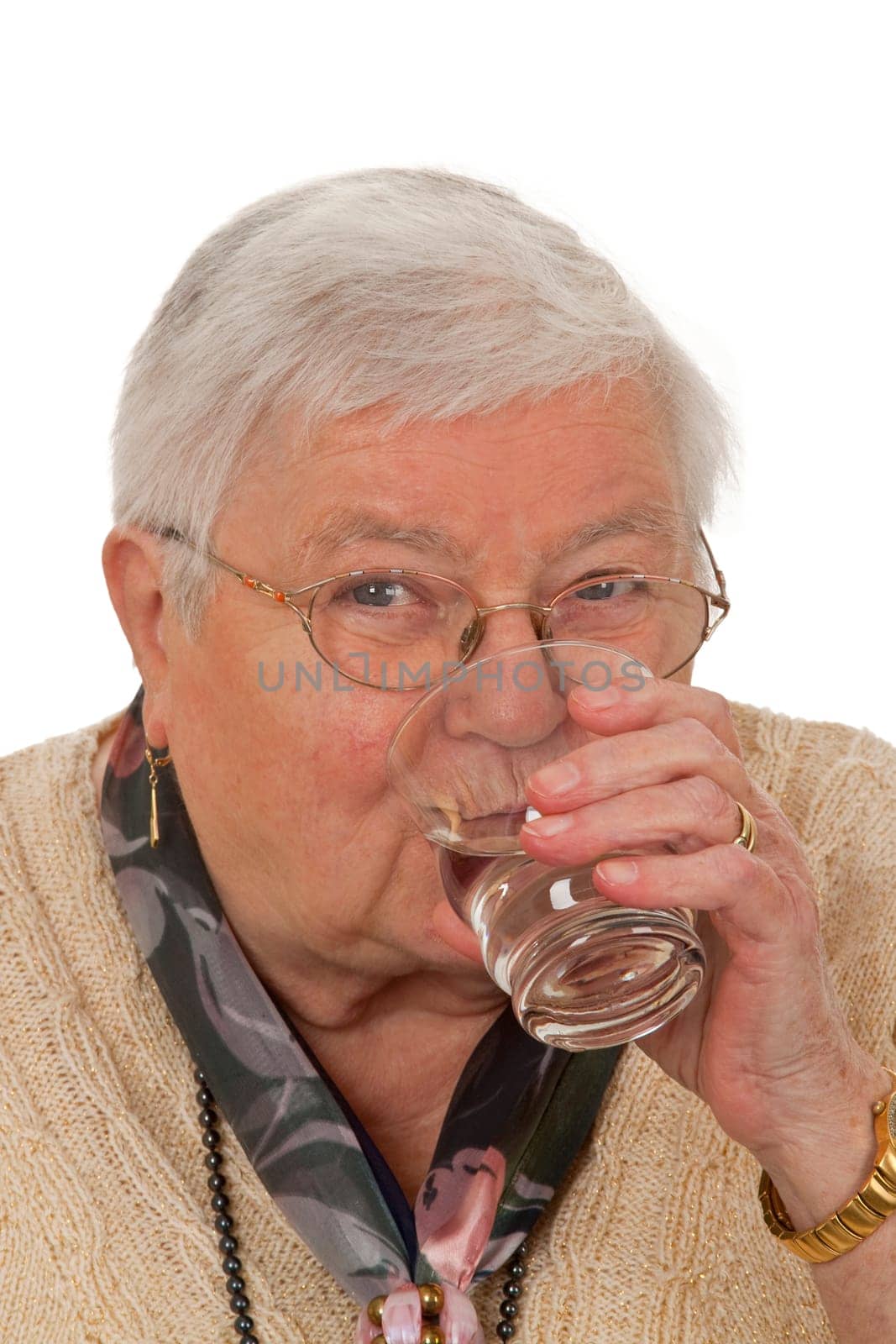 Senior woman drinking water isolated on white background