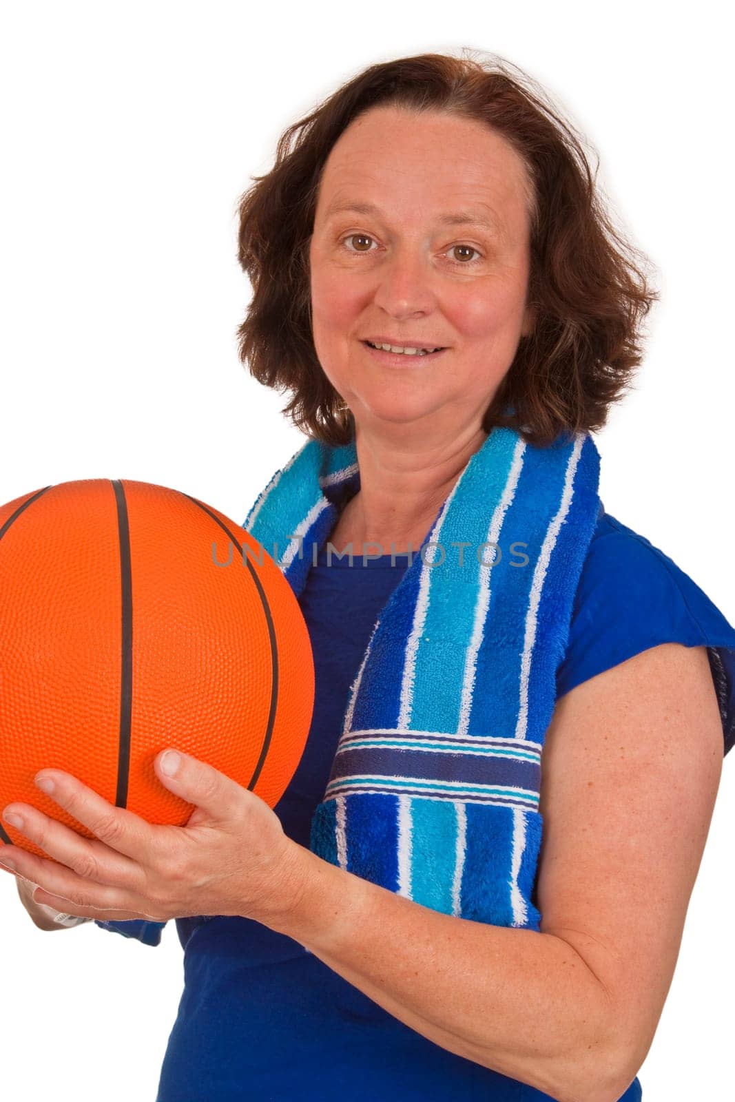 Middle aged woman with basketball on white background
