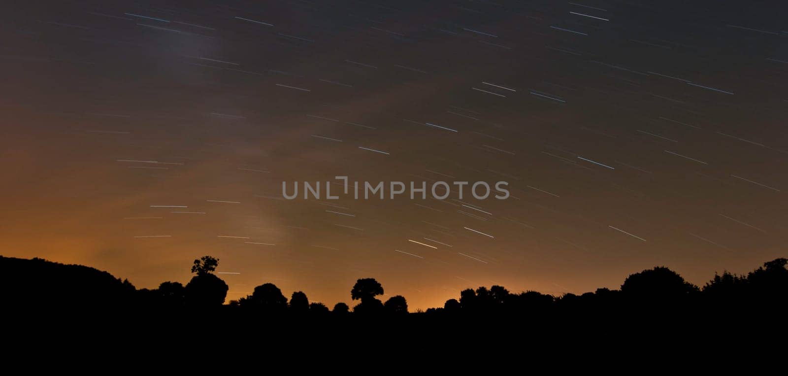 Long exposure photo of night sky with stars trail
