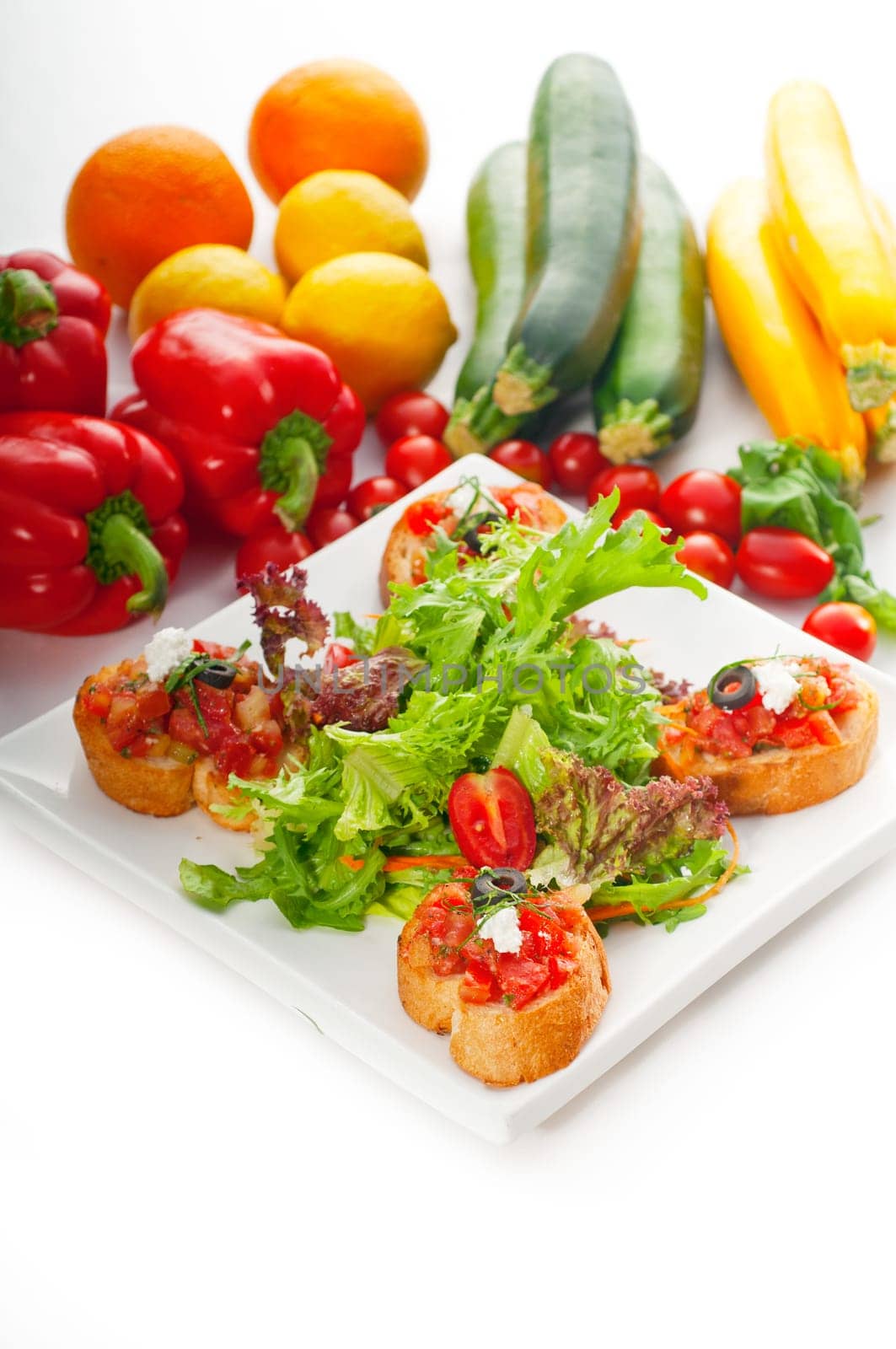 original Italian fresh bruschetta,typical finger food, with fresh salad and vegetables on background,MORE DELICIOUS FOOD ON PORTFOLIO
