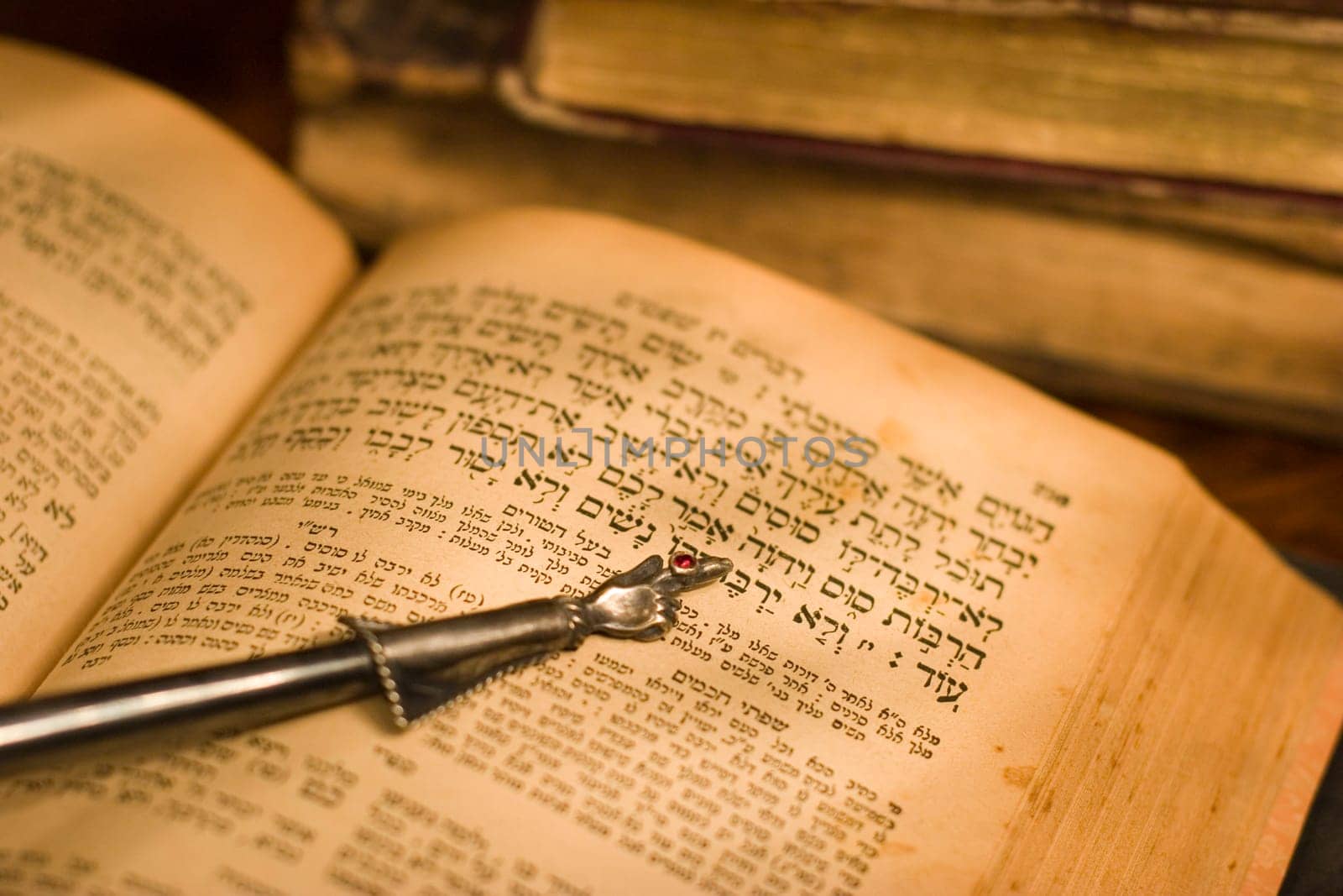 Old hebrew bible book and antique silver pointer.