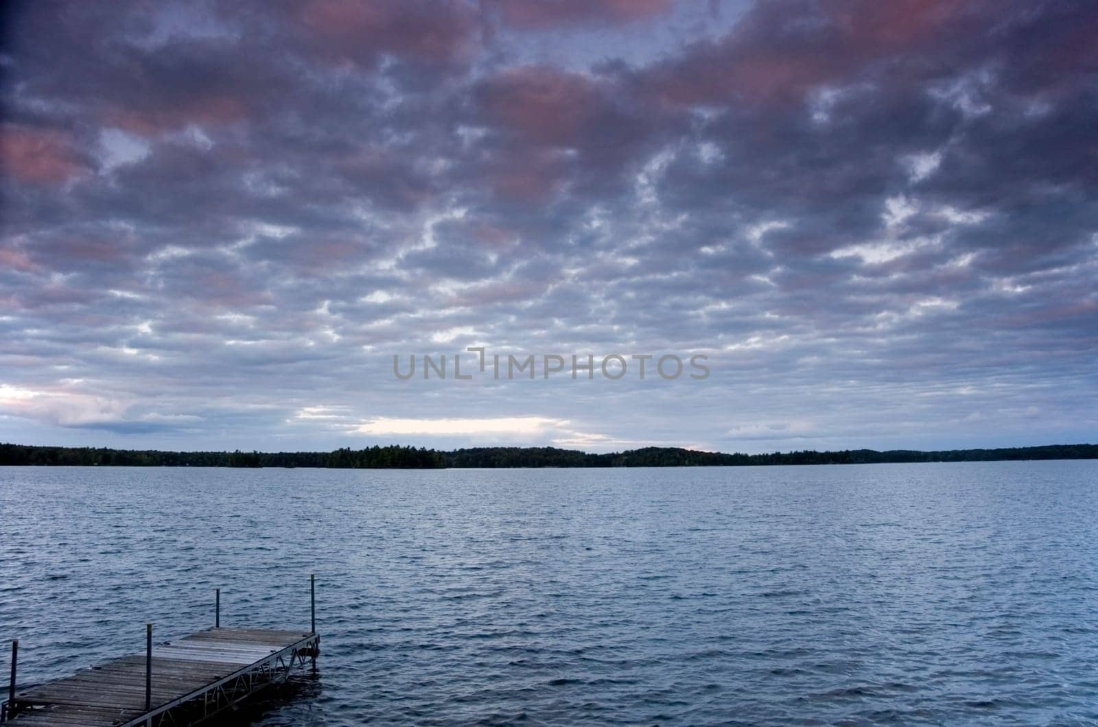 Dusk at the lake on a peaceful summer evening.