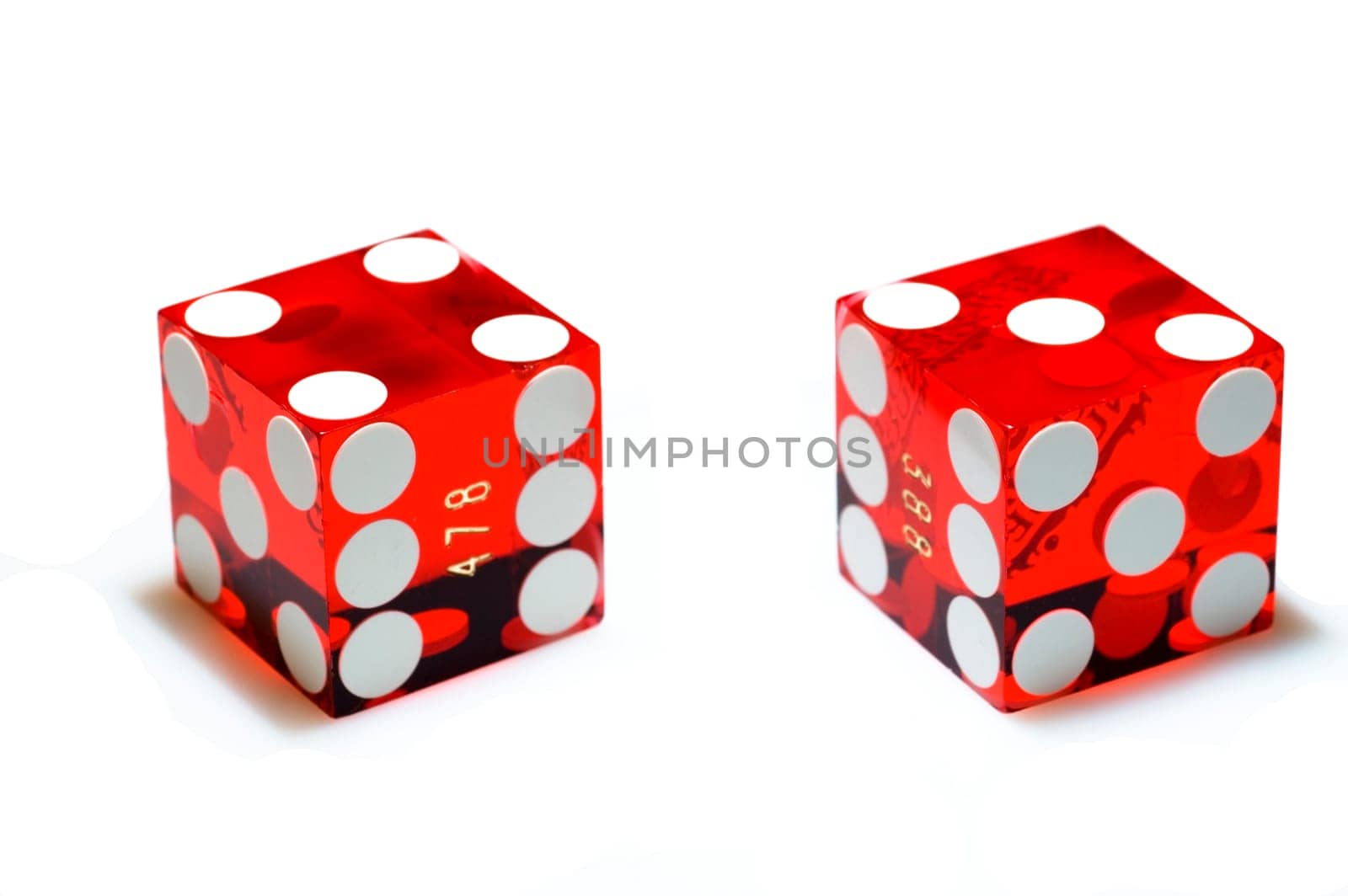 Real, red casino dice on a white background. Clipping path.