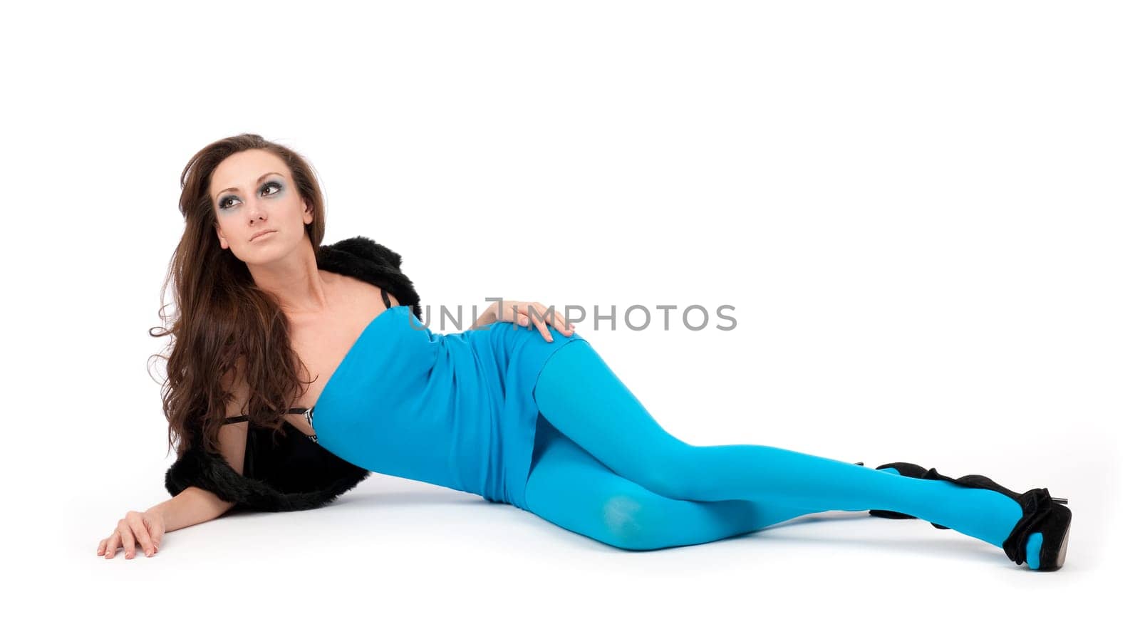 Portrait of a sexy young woman lying on the floor isolated on white background
