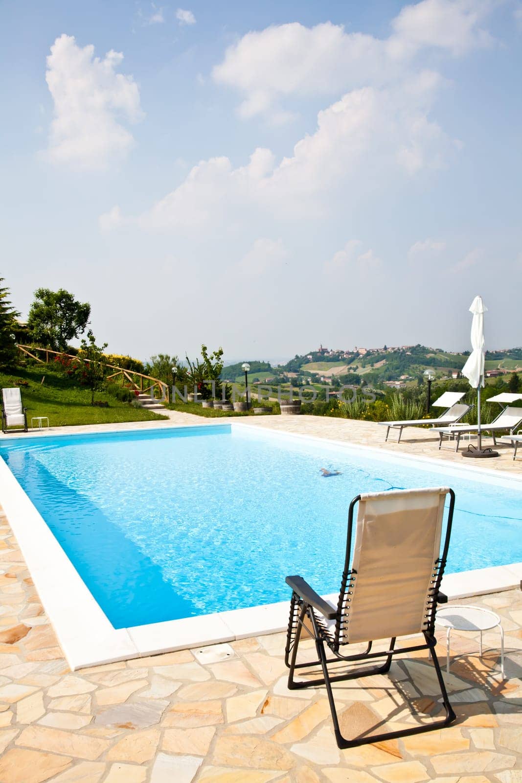 Swimming pool of an Italian beauty farm in the middle vineyards, Monferrato area, Piemonte region.