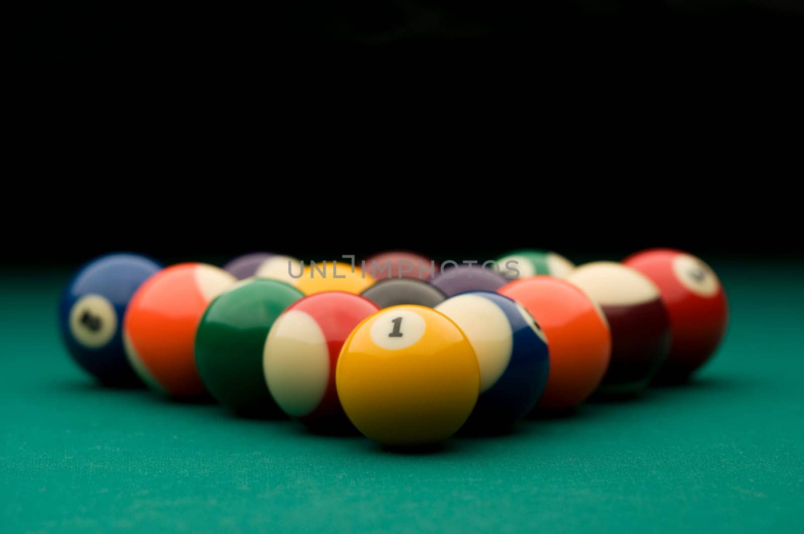 Billiard balls on the pool table.
