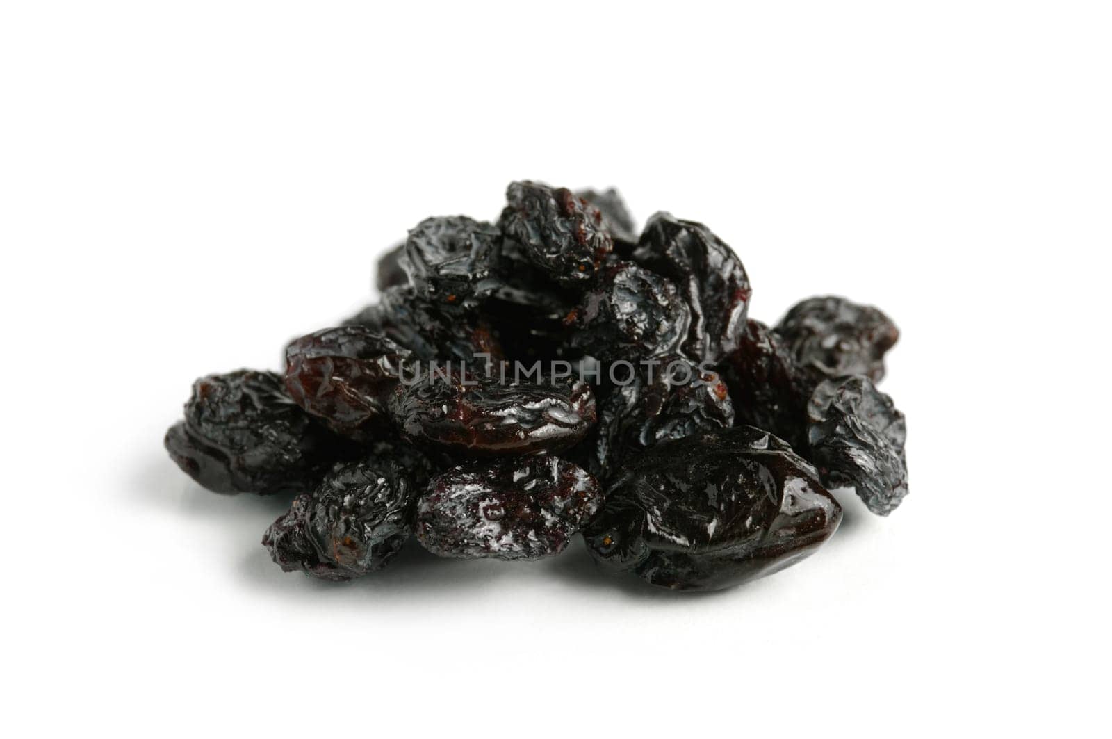 Black raisin close-up Isolated on white background