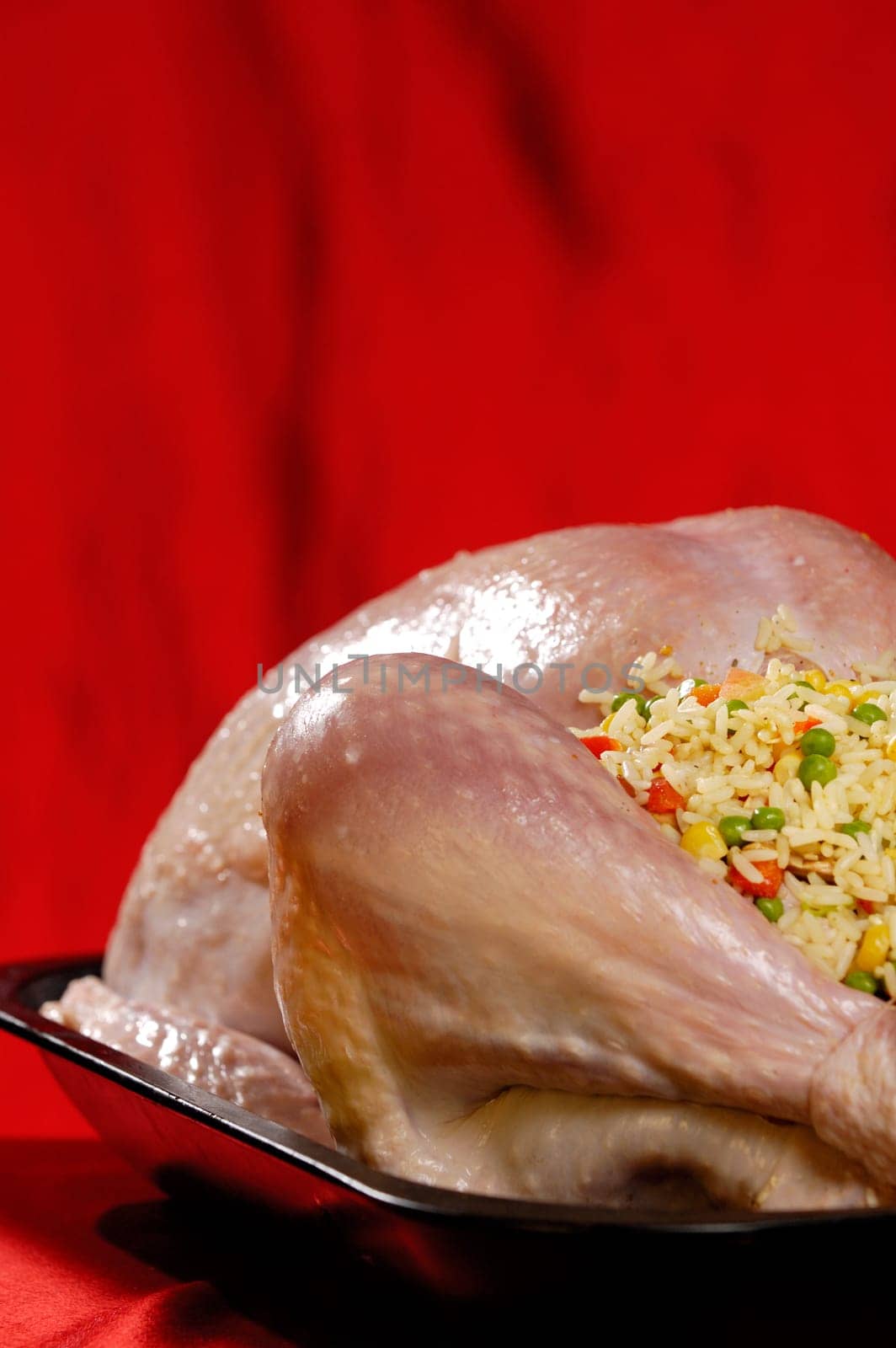 Prepared for cooking stuffed turkey in a baking tray