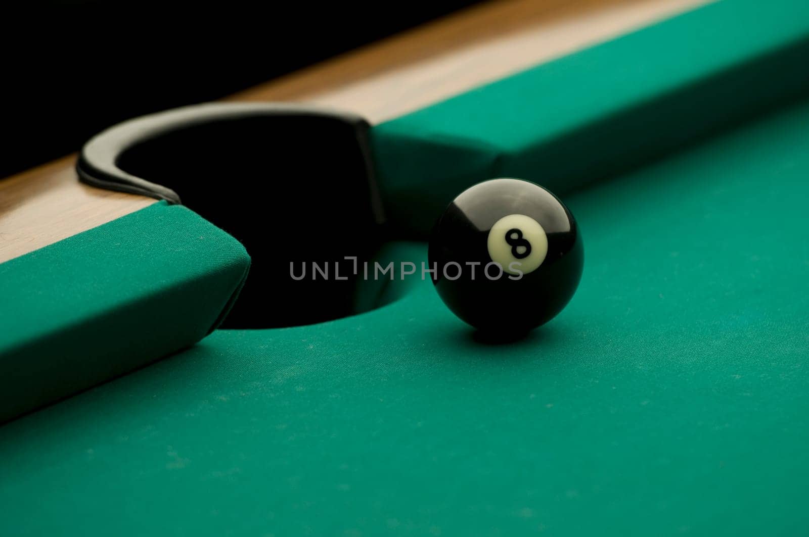 Eight ball on the pool table.