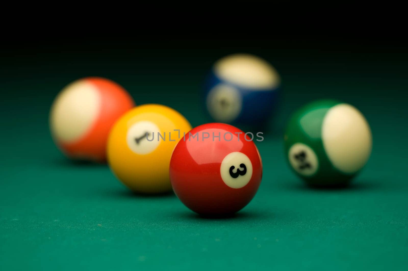 Billiard balls on the pool table.