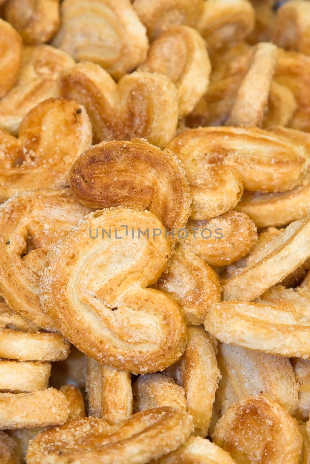 A scattering of sweet tasty cookies focus on heart shaped cookie