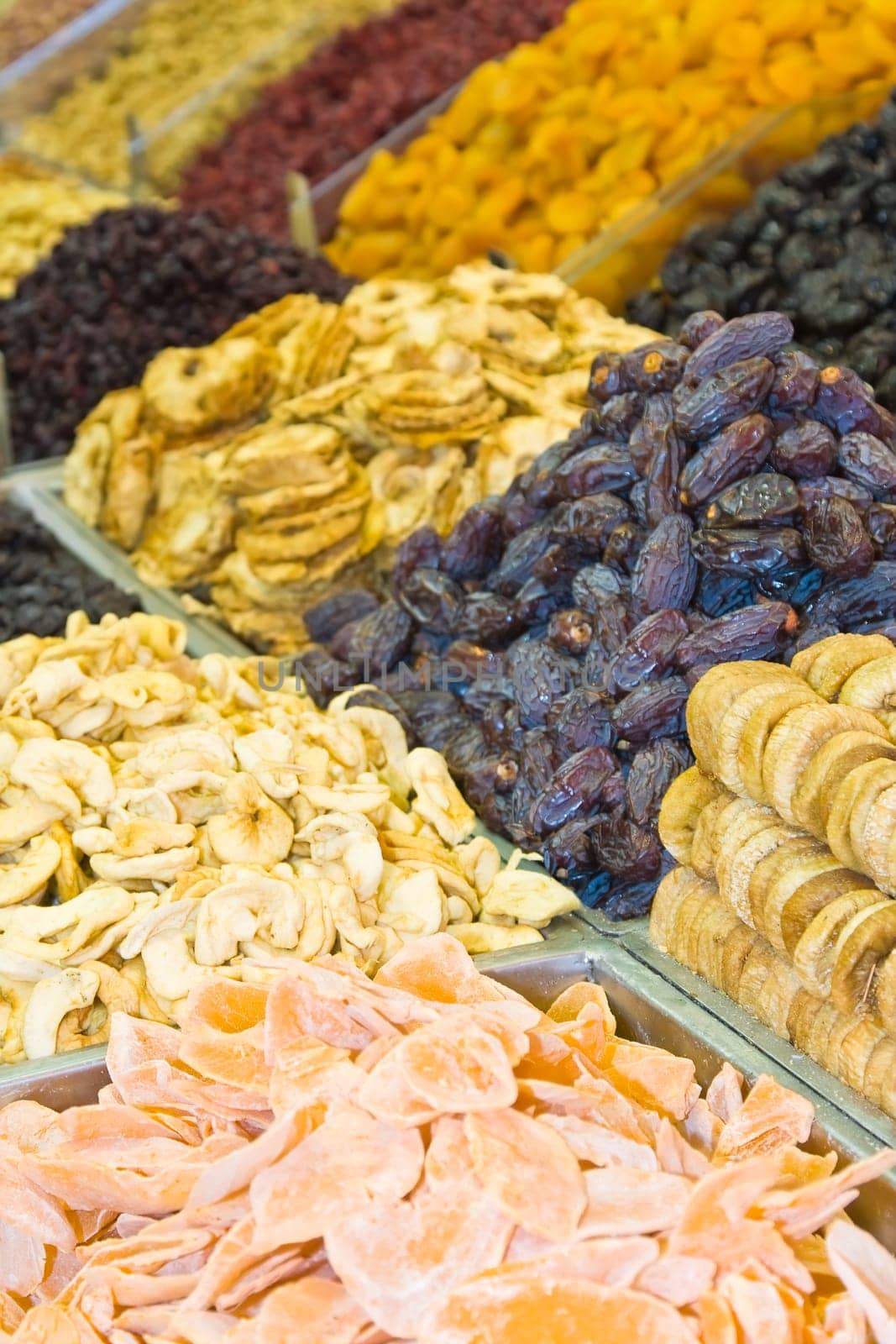 Colorful healthy dried fruits and dates in the market