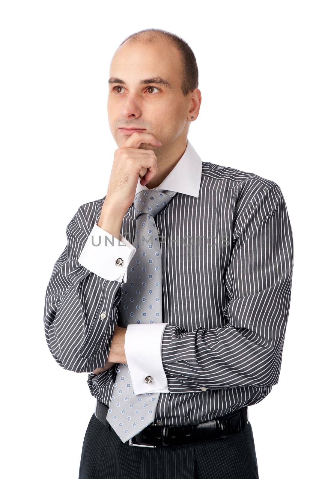 Portrait of handsome young business man looking away. Isolated on white