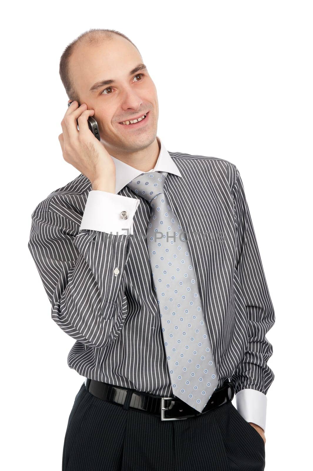 Portrait of young businessman talking on mobile phone. Isolated on white.