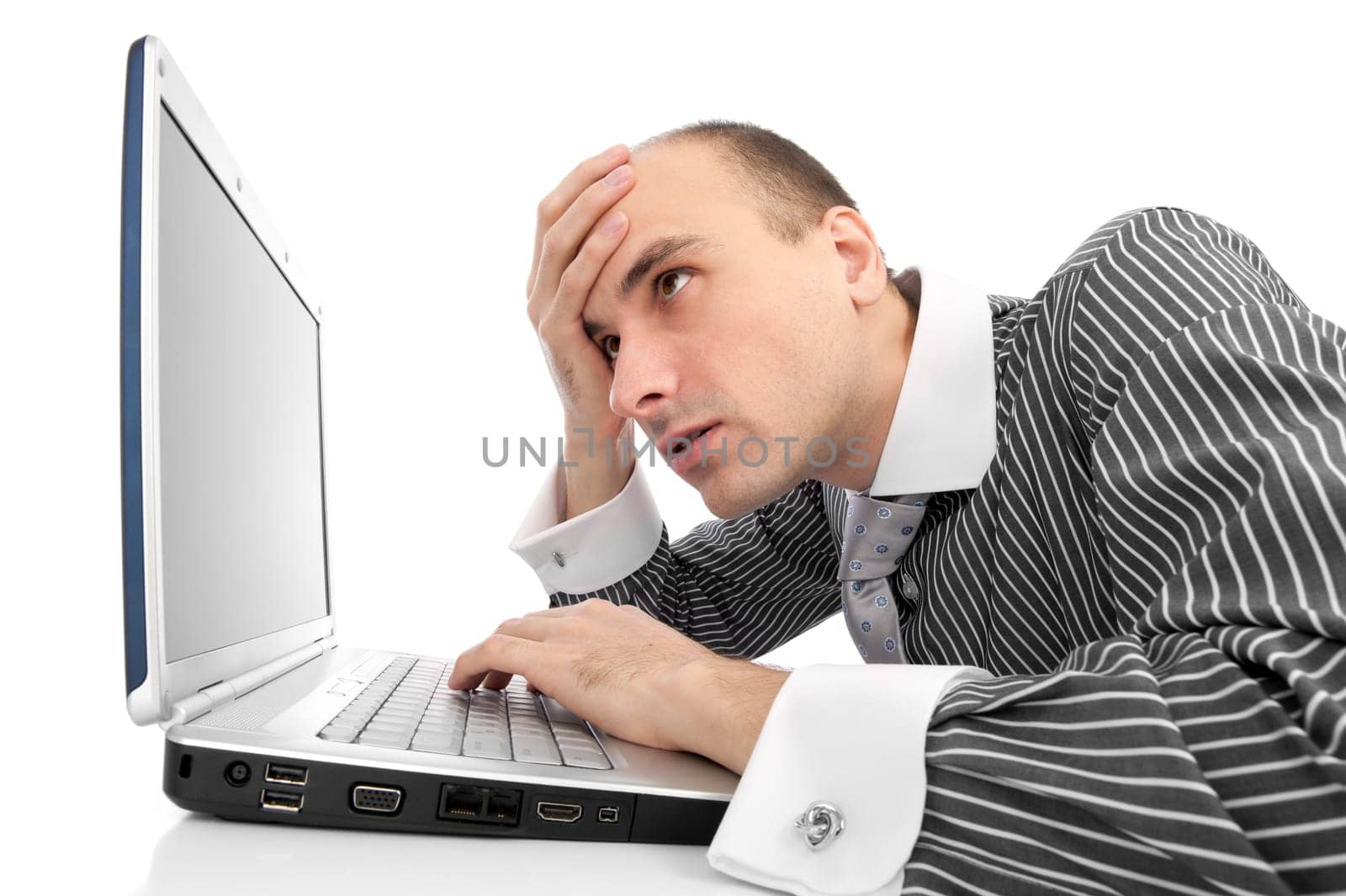 Worried businessman with computer isolated on white