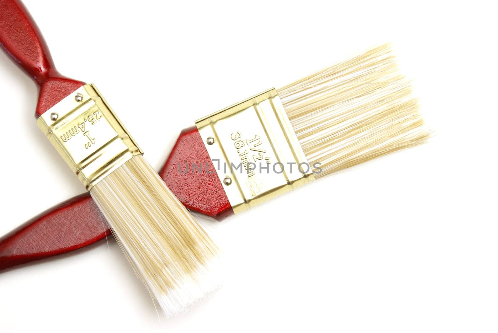 Two wooden paintbrushes over a white background.