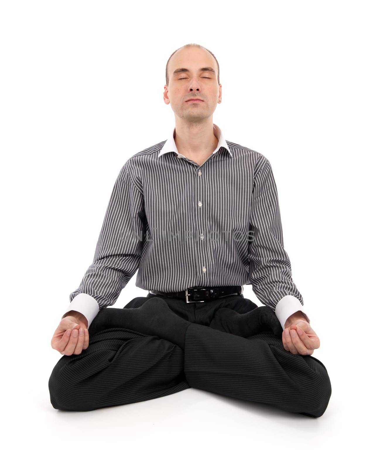businessman meditating in yoga lotus. Isolated on white background