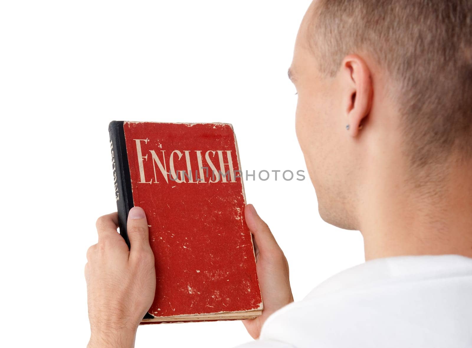 young man reading an English book. Rear view
