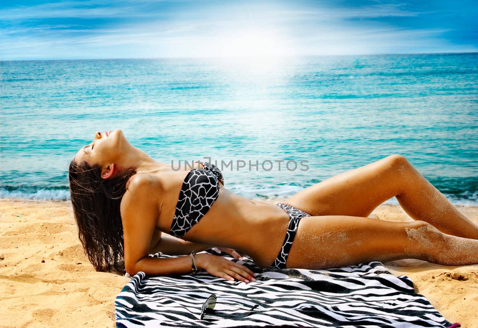 Fashion shot of beautiful woman on the beach