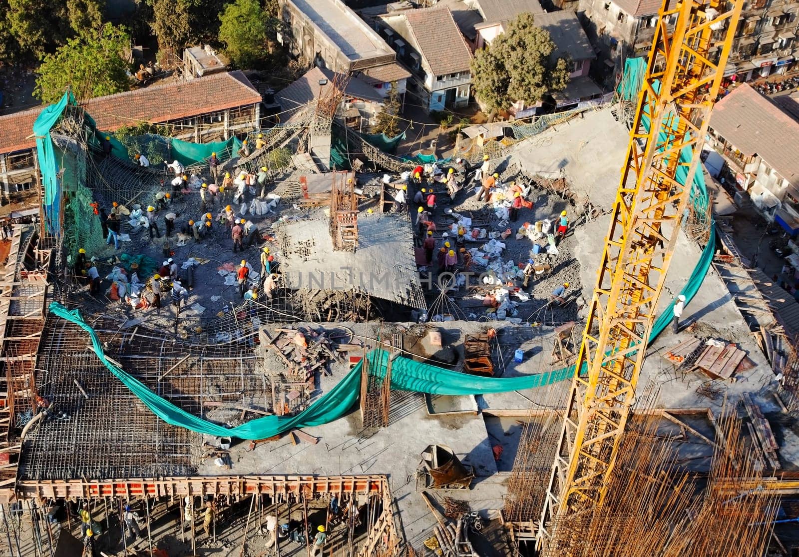 Mumbai, India, December 2011 - One of the floors collapses on a high rise office development, landscape and crop space