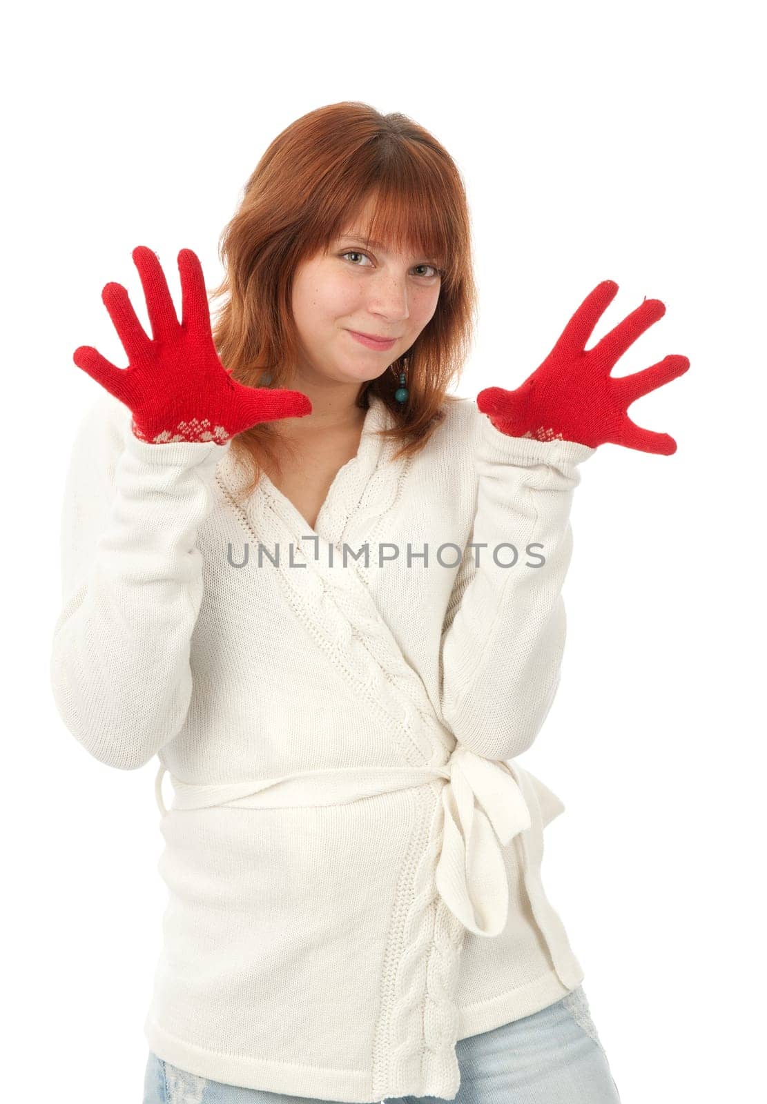 Beautiful redhead woman wint red mittens