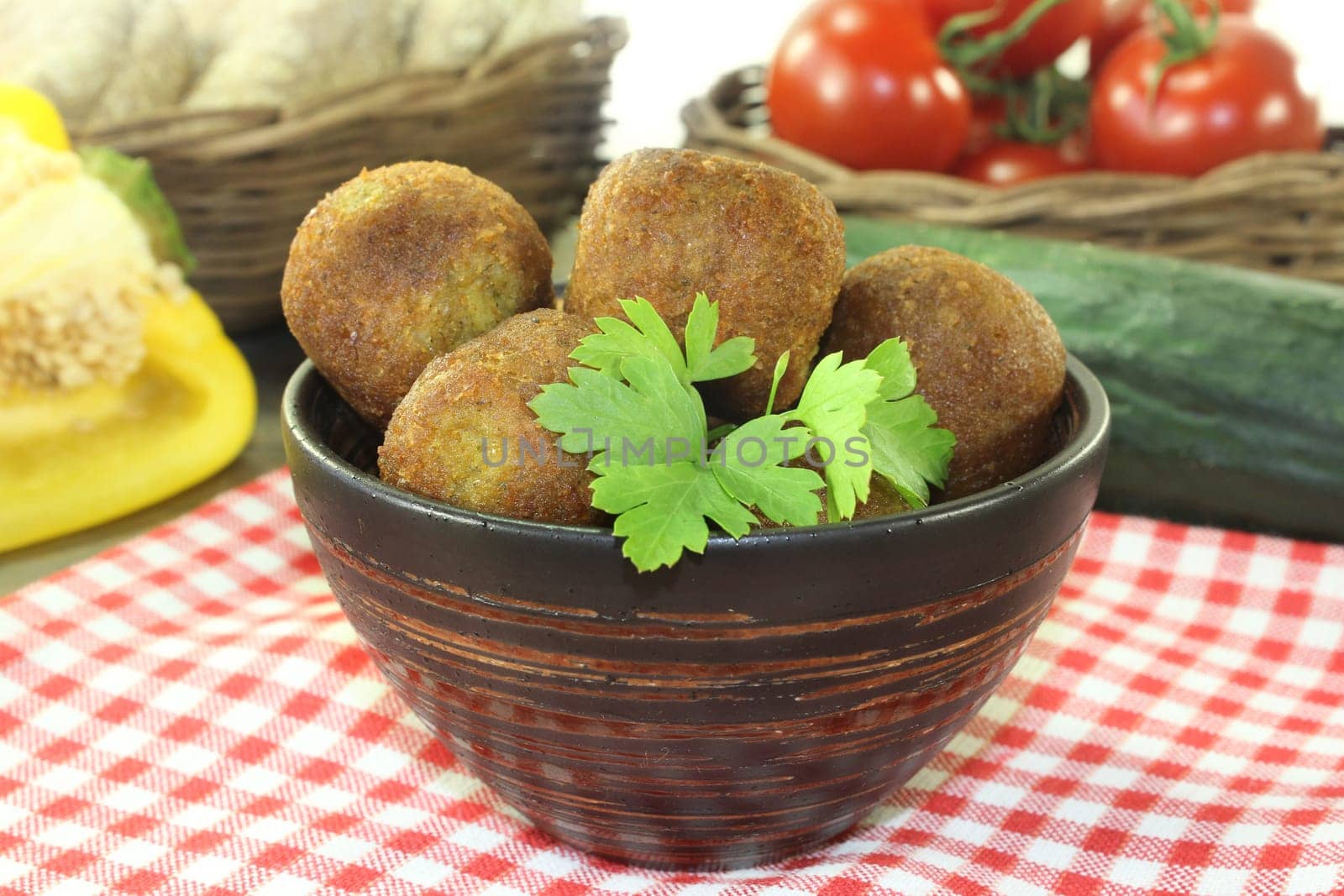 Falafel with fresh parsley against a bright background