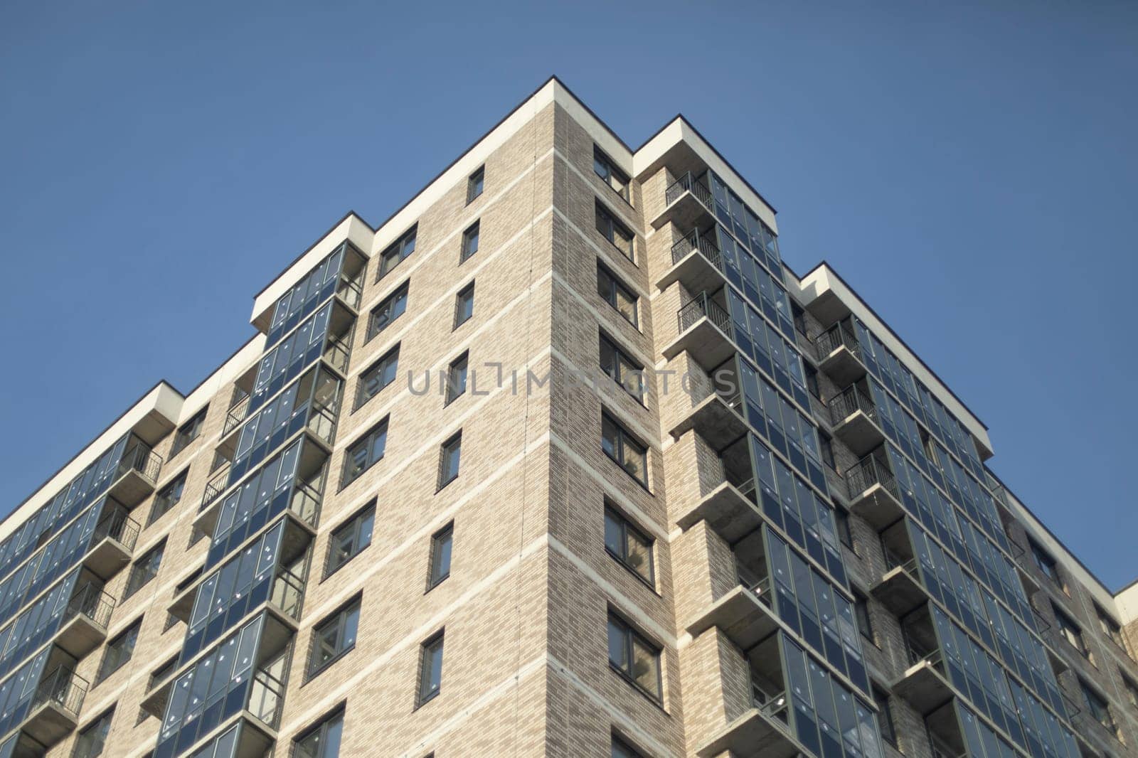 New building in city. Windows and balconies. Uninhabited house. New housing.