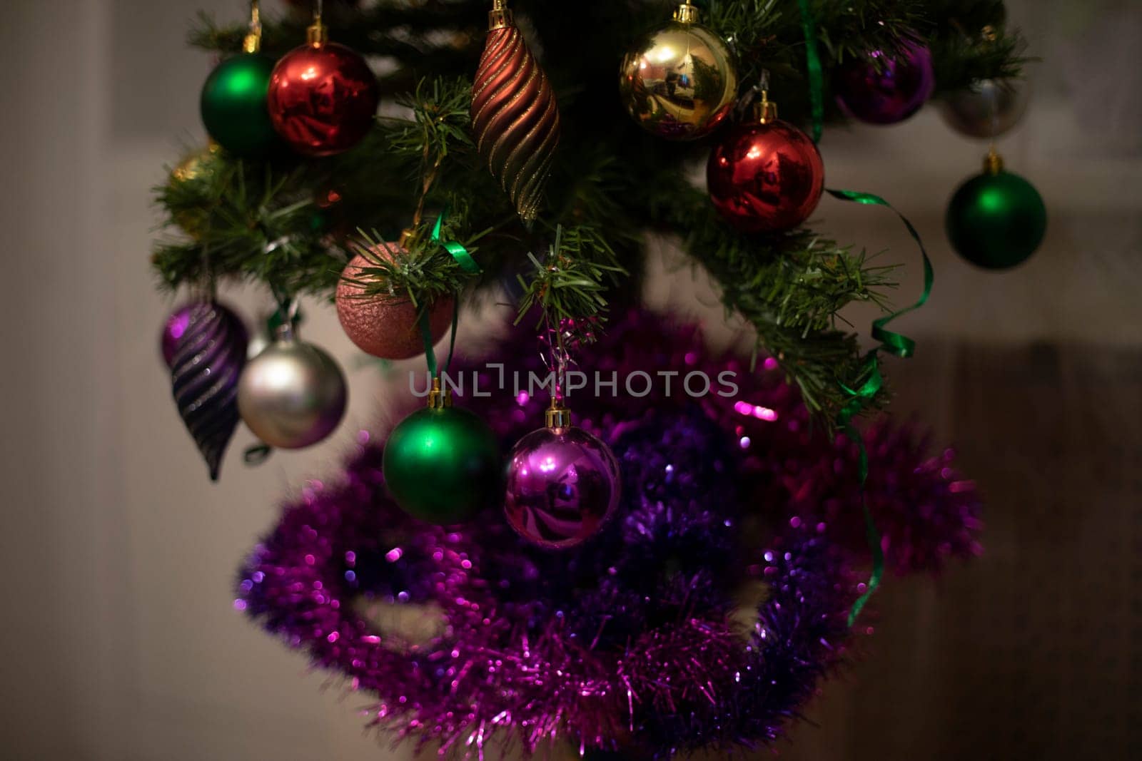 Christmas decoration on Christmas tree. Christmas tree at home. Christmas in apartment. Details of holiday.