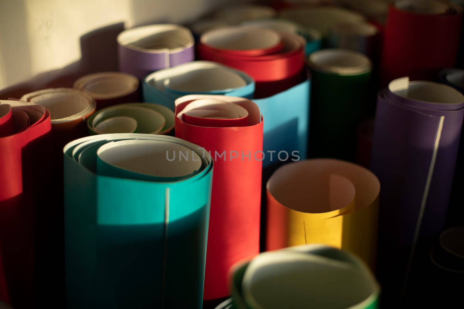 Colored paper. Film rolls. Adhesive paper for decorative works. Creative material.
