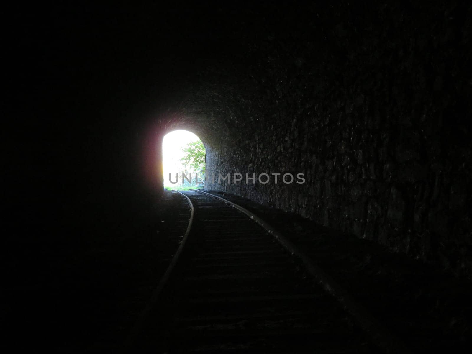 iron road bridges metal rail light at the end of the tunnel train transport