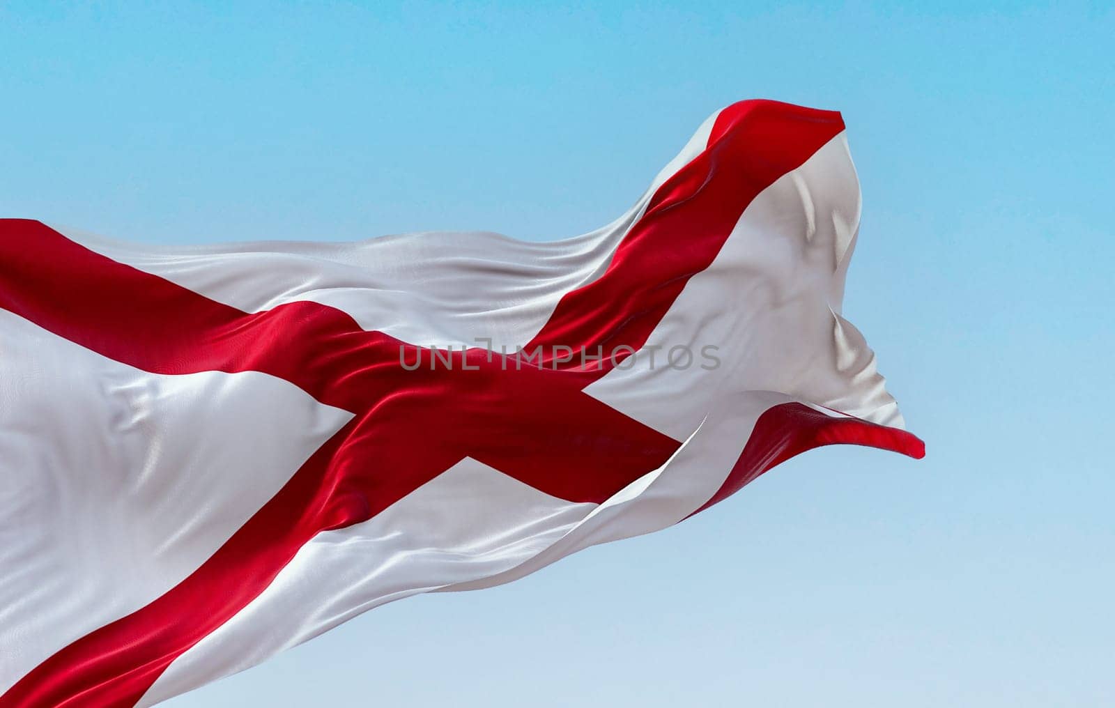 The state flag of Alabama waving in the wind on a clear day. Saint Andrew’s cross on a white background. 3D illustration render. Rippled textile
