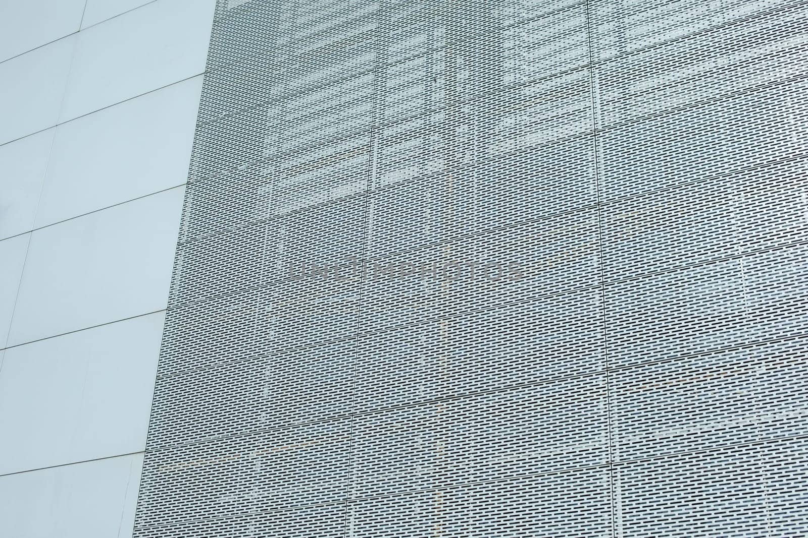 Steel wall of building. Grille on wall. Office building. Texture architecture.