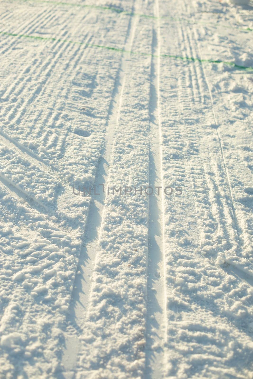 Ski track on snow. Ski track for skiing. Fresh snow in cold. Cool texture.