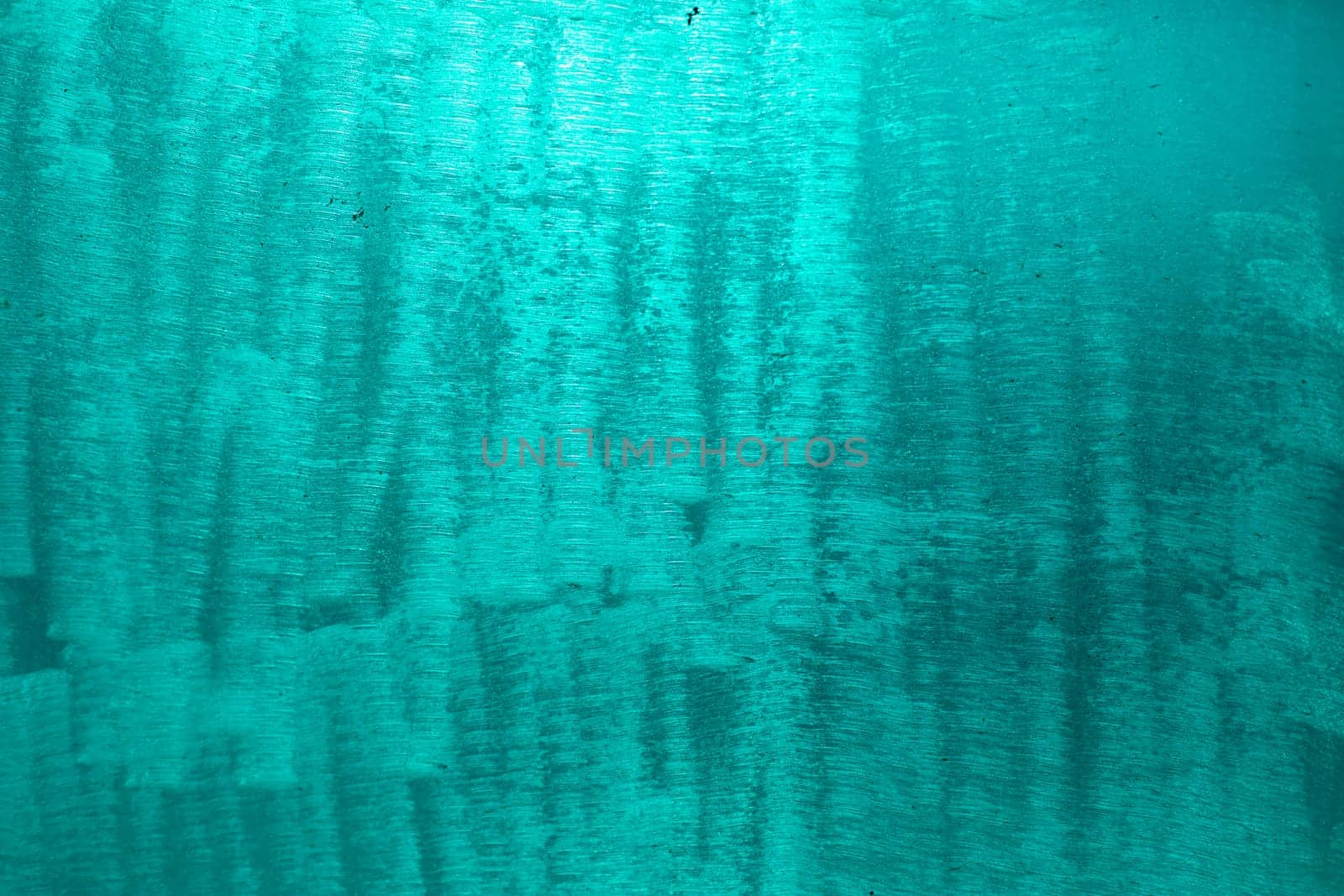 Blue texture made of plastic. Scratches on plastic. Dirty surface. Blue background.