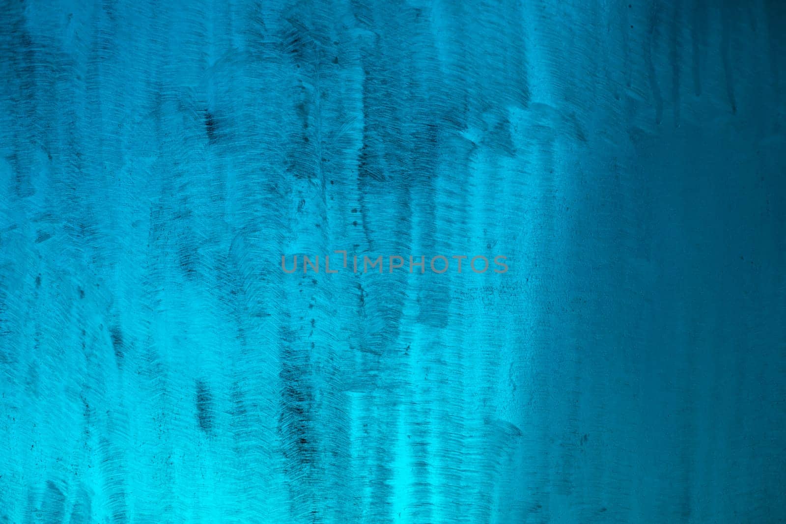 Blue texture made of plastic. Scratches on plastic. Dirty surface. Blue background.