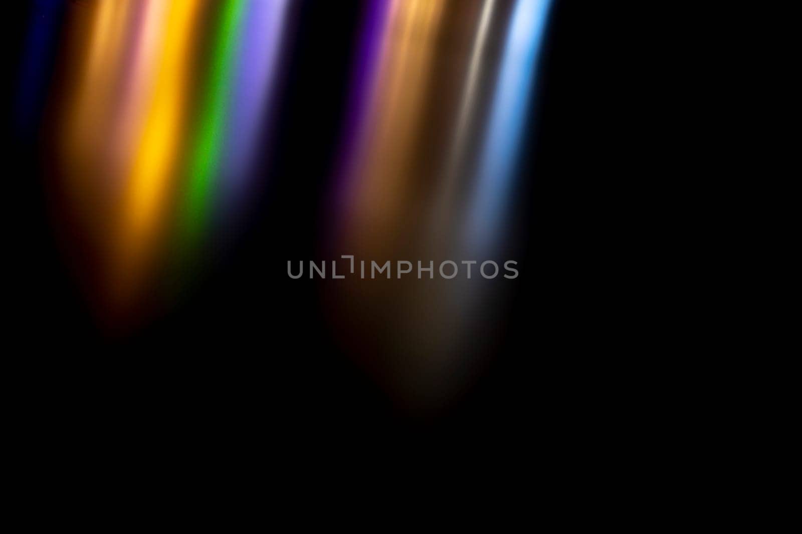Abstract texture reflection of light. Colored background highlights in surface. Stripes of color turning to black. Brilliance of light sources.