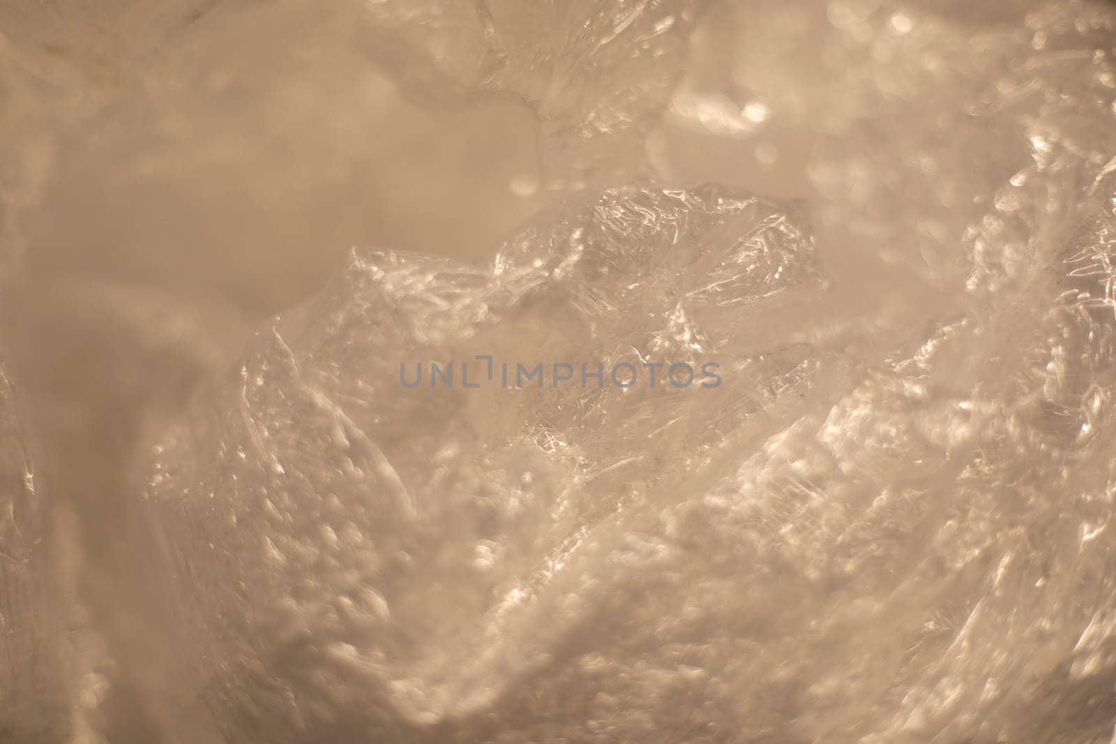 Texture of plastic bag. Transparent polyethylene. Crumpled film.